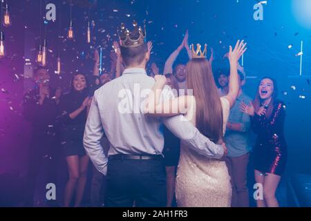 Back side view portrait of lovers have become king queen celebrating scream buddies enjoy dance floor Stock Photo