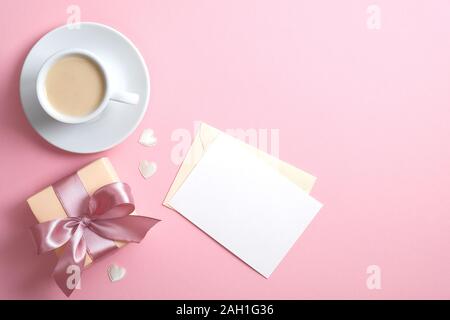Blank letter with rose, cup of coffee and hearts on white background ...