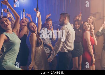 Portrait of formally-dressed people person youth move dance floor listen enjoy dj holidays dressed suit stylish trendy beautiful handsome indoors Stock Photo
