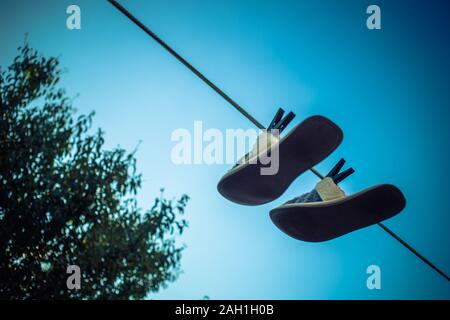 Home slippers are dried on a clothesline with clothespins Stock Photo