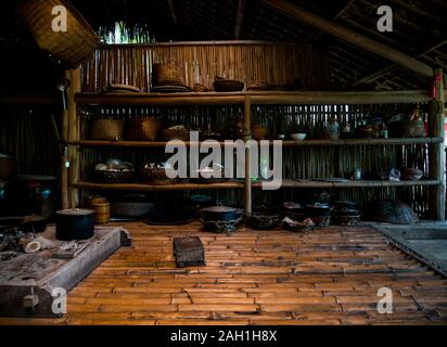 Interior view of traditional stilt house with open fire, Thai Hai ethnic village way of life, Thai Nguyen province, Northern Vietnam, Asia Stock Photo