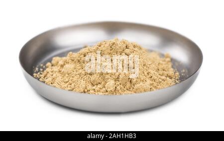 Some Powdered Ginger isolated on white (selective focus) Stock Photo