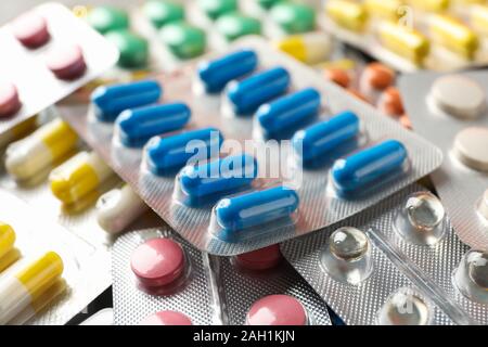 Pills in blister packs textured background, close up Stock Photo