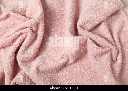 Pink crumpled towel textured background, close up Stock Photo