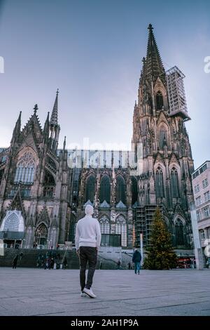 young men visit the city of Cologne Germany  Stock Photo