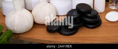 spa frame from bamboo grove, black zen stones on the old wooden background Stock Photo