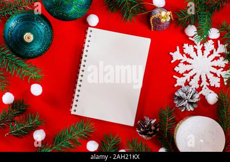 Top view Flat lay Christmas still life from christmas decorations on a red background Stock Photo