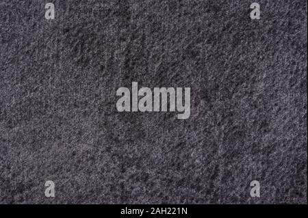 Dark gray soft cloth background. Texture of velvet canvas Stock Photo