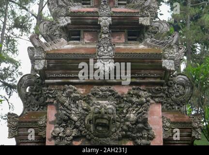 an elaborately carved temple gate at tirta empul on bali Stock Photo