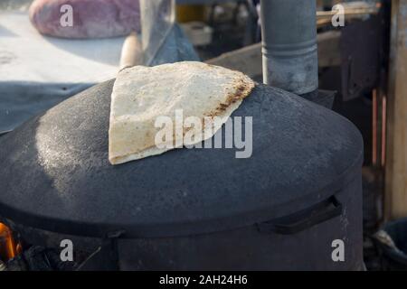 Traditional Druze Pita bread, baked on a Saj or Tava, on open fire Stock Photo