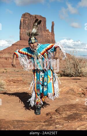 Navajo Dancer, West Mitten Butte in background, Monument Valley, Arizona and Utah border, USA Stock Photo