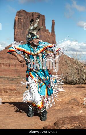 Navajo Dancer, West Mitten Butte in background, Monument Valley, Arizona and Utah border, USA Stock Photo