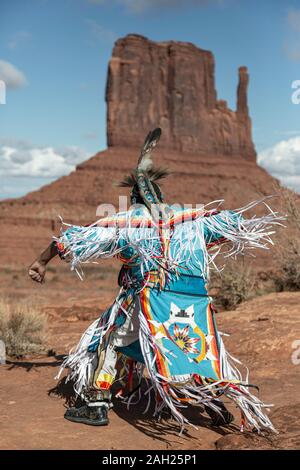 Navajo Dancer, West Mitten Butte in background, Monument Valley, Arizona and Utah border, USA Stock Photo