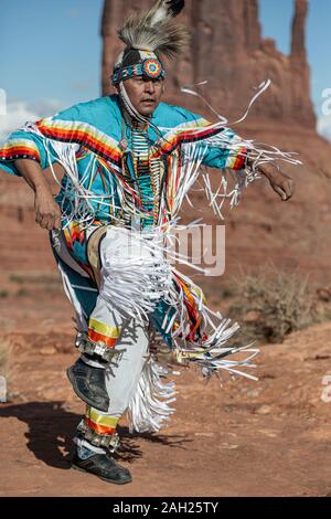 Navajo Dancer, West Mitten Butte in background, Monument Valley, Arizona and Utah border, USA Stock Photo