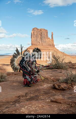 Navajo Dancer, West Mitten Butte in background, Monument Valley, Arizona and Utah border, USA Stock Photo