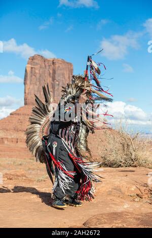 Navajo Dancer, West Mitten Butte in background, Monument Valley, Arizona and Utah border, USA Stock Photo