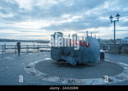 This giant sculpture of a head in the form of a ship is made by Brian Fell, in memory of merchant seafarers who got lost at sea. Stock Photo