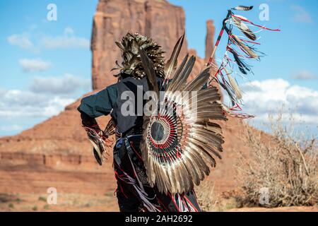 Navajo Dancer, West Mitten Butte in background, Monument Valley, Arizona and Utah border, USA Stock Photo