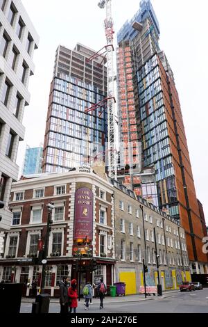 One Crown Place skyscraper under construction at 54 Wilson Street and The Flying Horse pub exterior in the City of London EC2 England UK  KATHY DEWITT Stock Photo