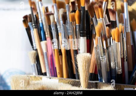 Painting brushes close-up. They have different sizes and colors. Stock Photo