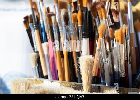 Painting brushes close-up. They have different sizes and colors. Stock Photo
