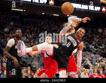 Sacramento, CA, USA. 23rd Dec, 2019. Houston Rockets guard Russell Westbrook (0) and Sacramento Kings forward Richaun Holmes (22) battle under the basket during a game at Golden 1 Center on Monday, Dec 23, 2019 in {city. Credit: Paul Kitagaki Jr./ZUMA Wire/Alamy Live News Stock Photo