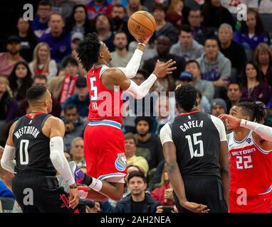 Sacramento, CA, USA. 23rd Dec, 2019. Sacramento Kings guard De'Aaron Fox (5) drives to the basket past Houston Rockets center Clint Capela (15) andHouston Rockets guard Russell Westbrook (0) during a game at Golden 1 Center on Monday, Dec 23, 2019 in {city. Credit: Paul Kitagaki Jr./ZUMA Wire/Alamy Live News Stock Photo