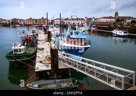 Fishing ships laying at quay on a winter morning, Saint-Jean de Luz, Basque country, Pyrénées-Atlantiques, France Stock Photo