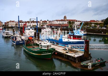 Fishing ships laying at quay on a winter morning, Saint-Jean de Luz, Basque country, Pyrénées-Atlantiques, France Stock Photo