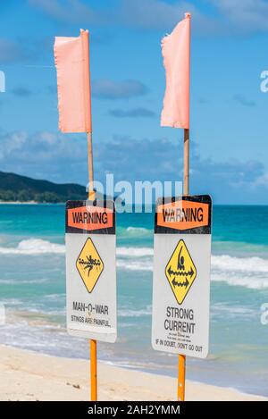 Man-o-war and strong current warning signs on Waimanalo Beach on Oahu, Hawaii Stock Photo