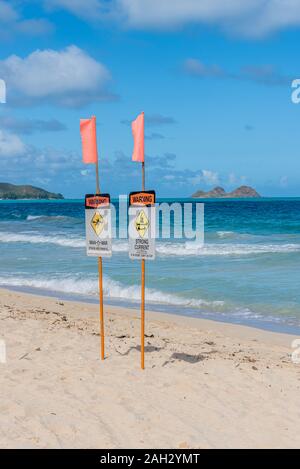 Man-o-war and strong current warning signs on Waimanalo Beach on Oahu, Hawaii Stock Photo
