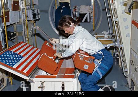 (25 June-9 July 1992) --- Astronaut Bonnie Dunbar, payload commander, unstows United States Microgravity Laboratory 1 (USML-1) experiment paraphernalia in early stages of the mission. Stock Photo