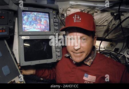 (25 June-9 July 1992) --- Astronaut Richard Richards, STS-50 mission commander, stands by a monitor displaying a group of elementary pupils (Addison Elementary School, Marietta Georgia) who were among the many students and others on Earth who communicated with members aboard the Earth-orbiting Space Shuttle Columbia. Stock Photo