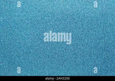 blue colored glitter paper texture abstract or natural shiny canvas background Stock Photo
