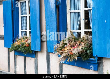 Detail of beautiful window decorations in a half-timbered house made entirely out of natural materials Stock Photo