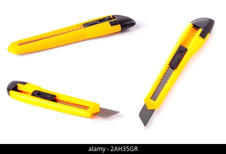 The yellow stationery knife isolated on white background Stock Photo