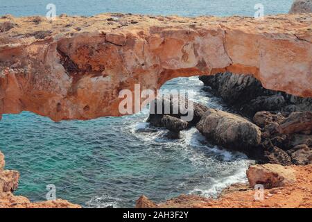 Natural stone arch on sea coast. Cape Greco, Aya Napa, Cyprus Stock Photo