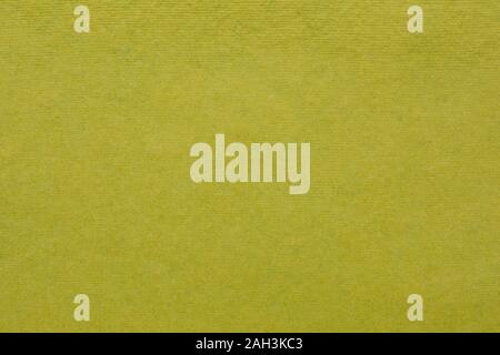 background and texture of olive green handmade Indian paper created from recycled cotton fabric Stock Photo