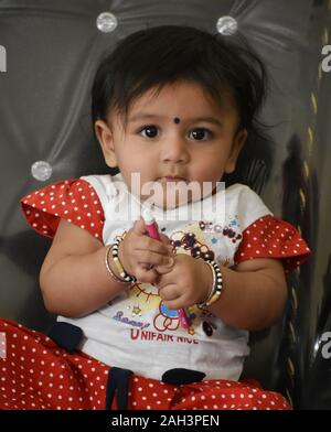 A cute Baby Girl in Joy Mood Stock Photo