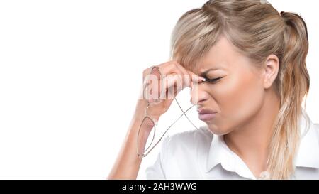 Tired woman has eyes pain. Optician and eyeglasses. Tired woman with eyeglasses has eyes pain. Close up photo isolated on white. Stock Photo