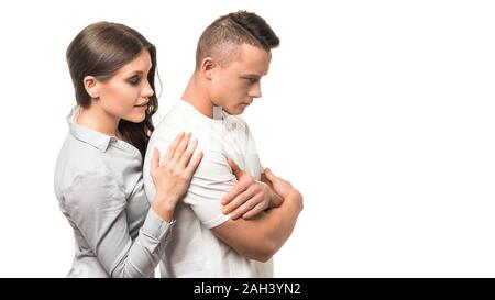 Portrait of calm woman embracing caucasian man. Woman hugging her husband for reconciliation. Love and support concept. Stock Photo
