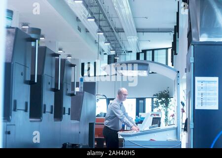 Manager working in printing house Stock Photo