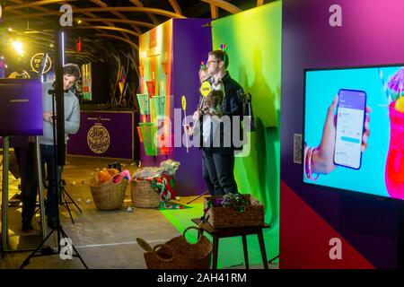 Visitors to the Yahoo Mail and BuzzFeed “Slay the Holidays” pop up in New York on Friday, December 13, 2019 take part in an instagrammable moment. The branding event was a promotion for the new Yahoo Mail app. (© Richard B. Levine) Stock Photo