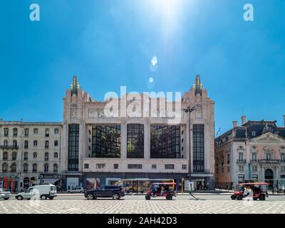 Restauradores Square and the former Teatro Eden against the sun, Lisbon, Portugal Stock Photo