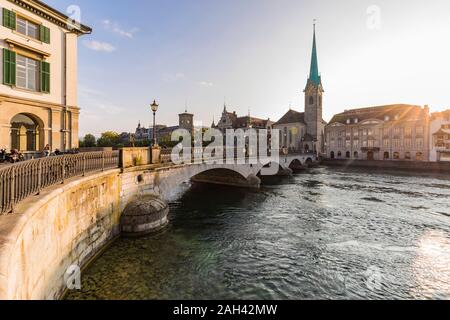 Switzerland, Canton of Zurich, Zurich, Munsterbrucke bridge at sunset with Fraumunster church in background Stock Photo