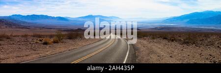 USA, California, Panorama of empty highway in Death Valley Stock Photo