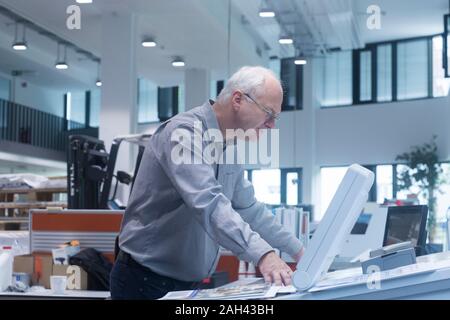 Manager working in printing house Stock Photo