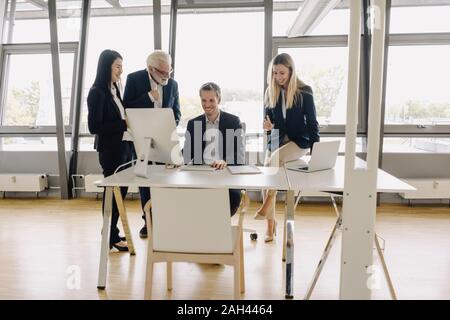 Happy business people having a meeting in office Stock Photo