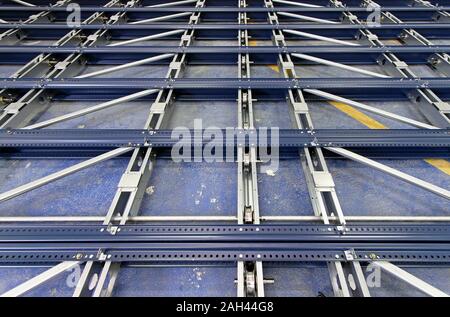 Metal base and rollers for automated shelving system Stock Photo