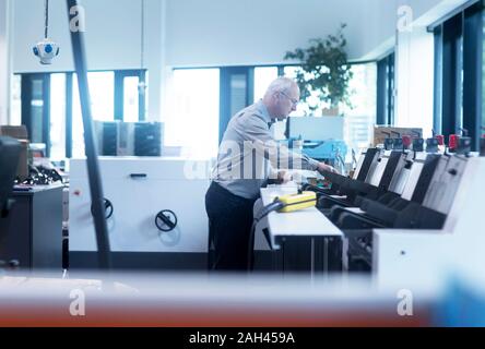 Manager working in printing house Stock Photo